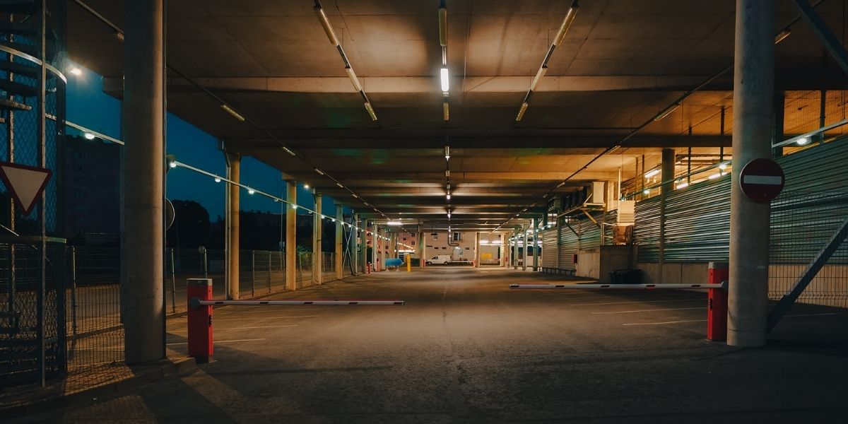 Parking lot at night with lighting - property owners must provide adequate security measures